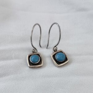 Small dangle Sterling Silver earrings featuring a blue larimar stone